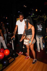 Two people bowling